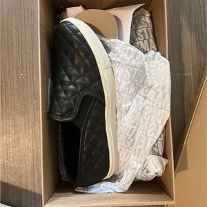 New, never worn Steve Madden ECENTRCQ BLACK slip ons, size 7.